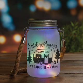 Making memories on campsite solar mason jar with colored lights and family name 