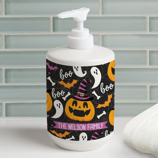 Soap dispenser featuring a spooky Halloween pumpkin and ghost pattern, personalized with a name for a festive touch