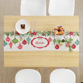 Table runner featuring an ornaments pattern, customizable with up to 12 names and a name an initial in the center