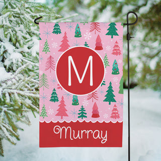 Garden flag featuring a pink pine forest design, personalized with a name and initial