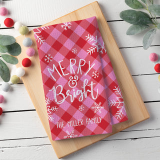 Waffle tea towel featuring a "Merry & Bright" message with a pink and red check pattern, personalized with a name at the bottom.