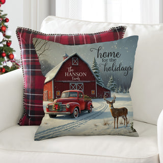 
14-inch by 14-inch throw pillow featuring a "Home For The Holidays" design with a red barn, personalized with a name.