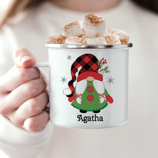 Camp mug featuring a green gnome with a red and black check pattern hat and 2 red buttons personalized with a name at the bottom